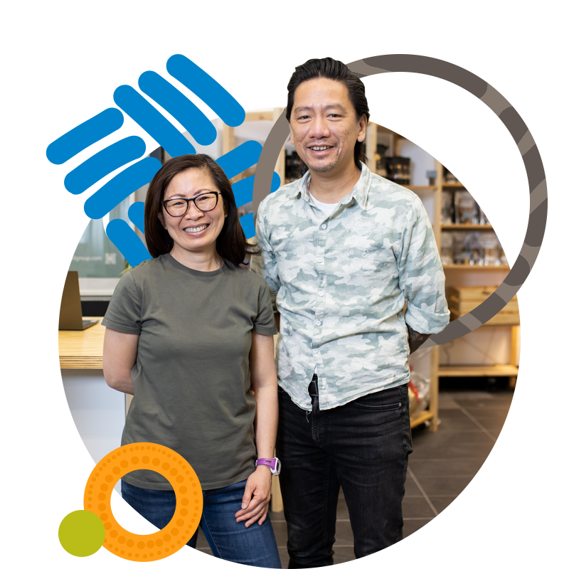 Man and woman facing the camera smiling